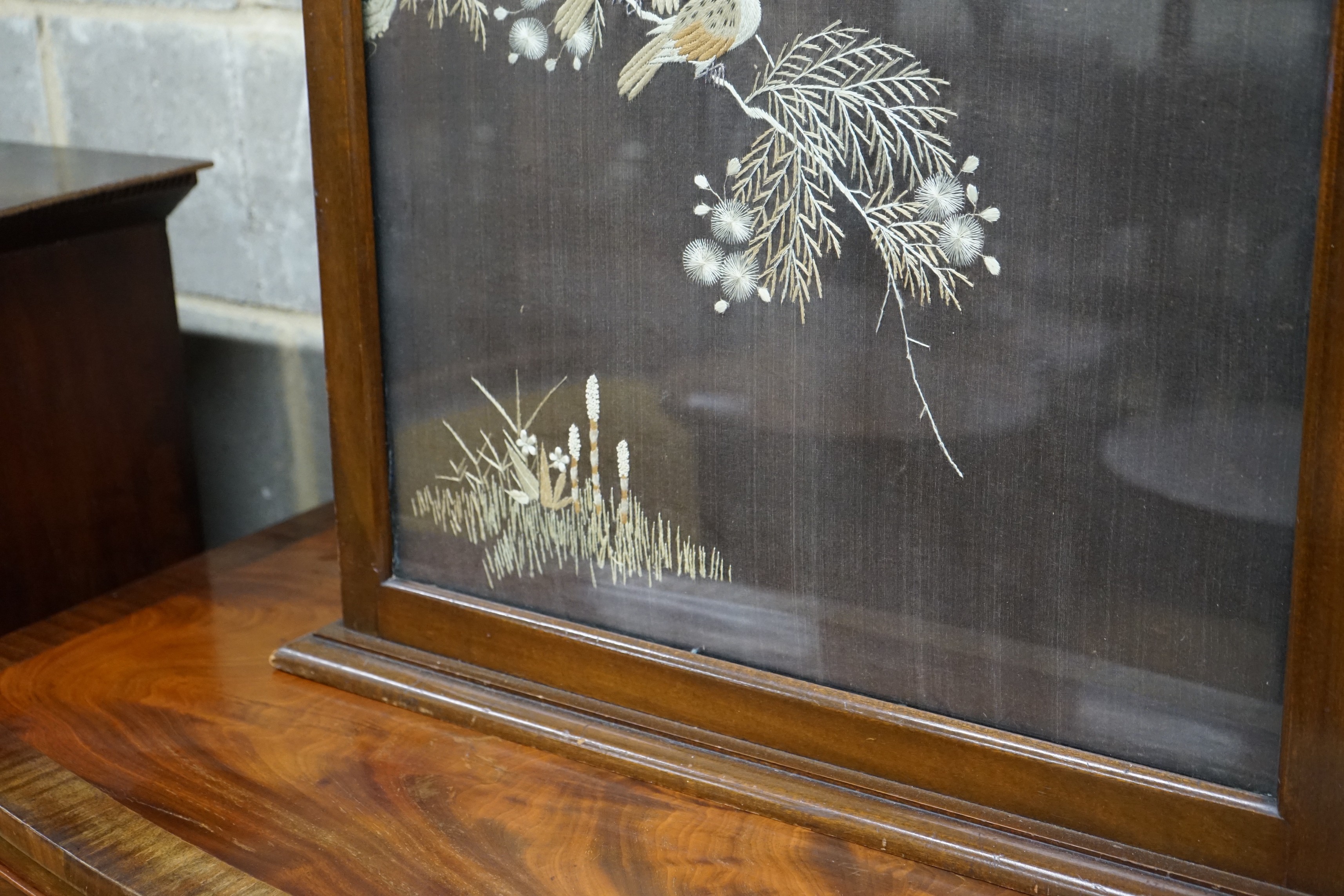 An Art Deco style rectangular mahogany fire screen inset Chinese silkwork panel, width 66cm, height 74cm